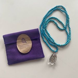 Mariquita Masterson Opera length beaded necklace with clear glass pendant.